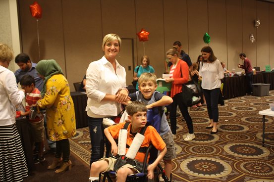 A mother and 2 sons at the deaf-blind Family Learning Conference