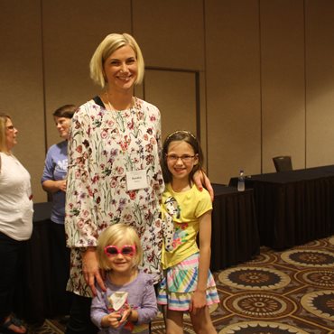 A mother and 2 daughters at the deaf-blind Family Learning Conference