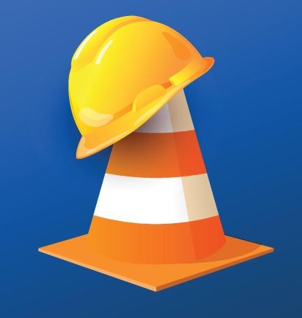 Image of a hard hat on top of a highway cone